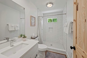 Shower, eco-friendly toiletries, hair dryer, towels