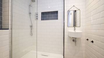 Shower, hair dryer, towels, shampoo