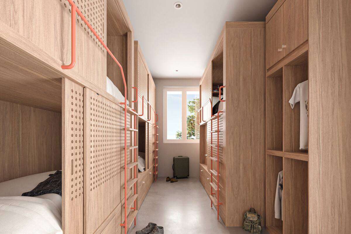 Un dormitorio moderno con literas, un armario y una pequeña zona de escritorio.