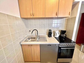 Fridge, stovetop, cookware/dishes/utensils