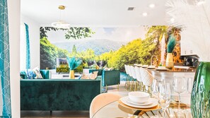 Enjoy a panoramic view of the surrounding mountains from this elegantly furnished dining area.