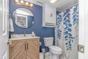 Combined shower/bathtub, hair dryer, towels, soap