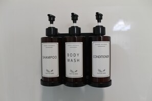Shower, hair dryer, towels, soap