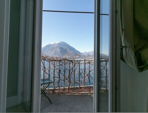 Enjoy breathtaking views of the surrounding mountains and water from the balcony.