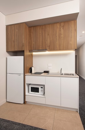Standard Studio Apartment | Private kitchen | Full-size fridge, microwave, stovetop, espresso maker - Durham Serviced Apartments (Glenelg)