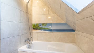 Bathtub, hair dryer, towels