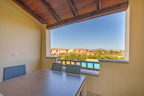 Outdoor dining - Holiday Apartment "Cocco" with Shared Pool, Private Terrace & Balcony (loiri porto san paolo)
