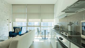 Deluxe Studio | Private kitchen | Fridge, microwave, oven, dishwasher