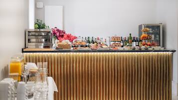 A breakfast buffet with various food items and beverages.