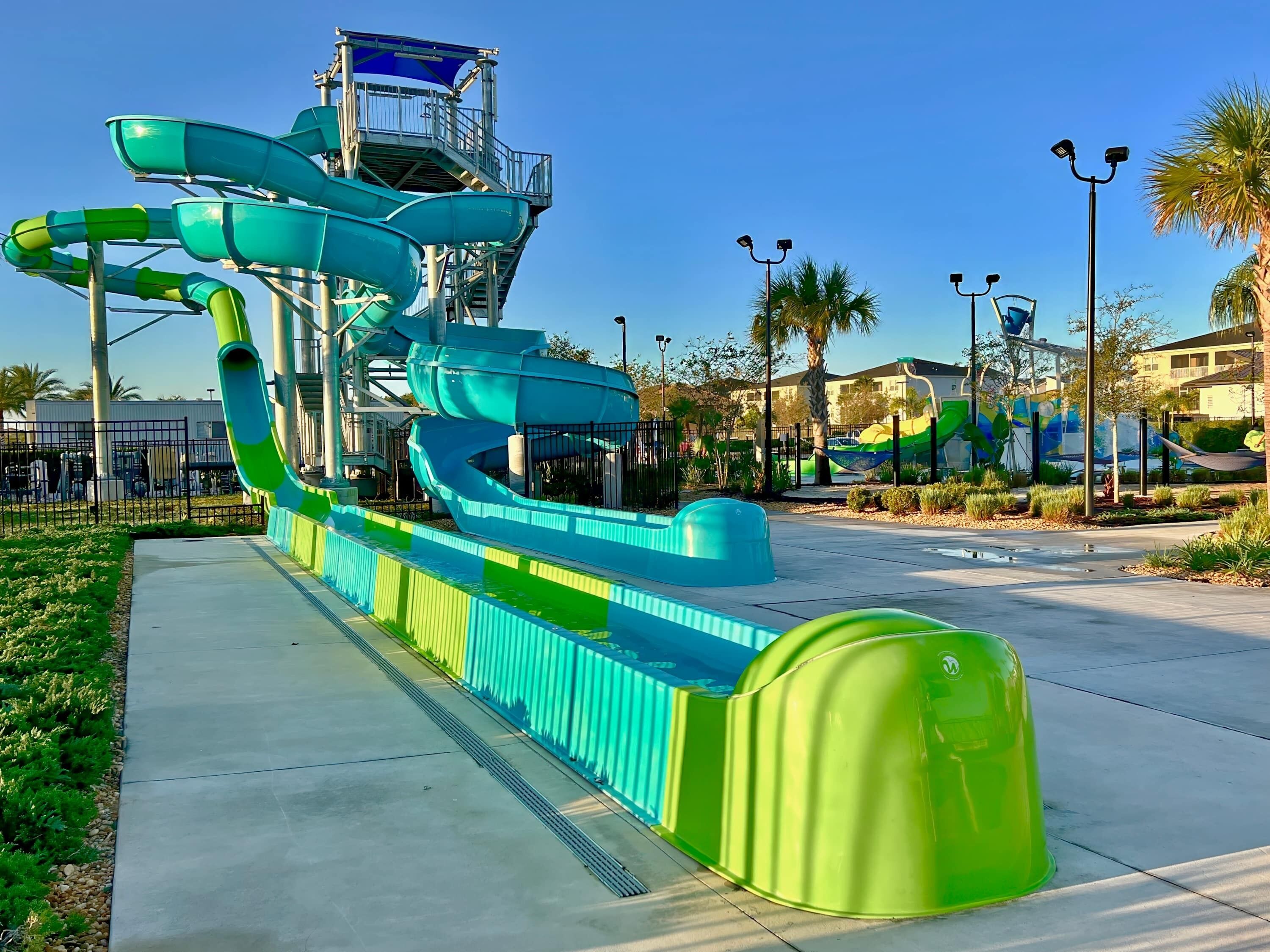 A water park with multiple slides and a viewing platform.