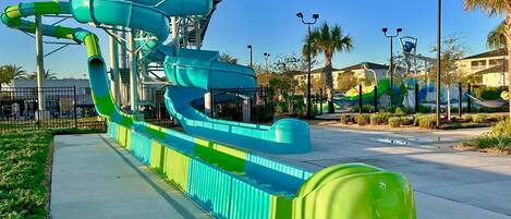 A water park with multiple slides and a viewing platform.