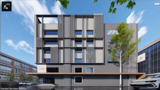 Un edificio moderno con techo plano, varias ventanas y un letrero que dice "Casa".