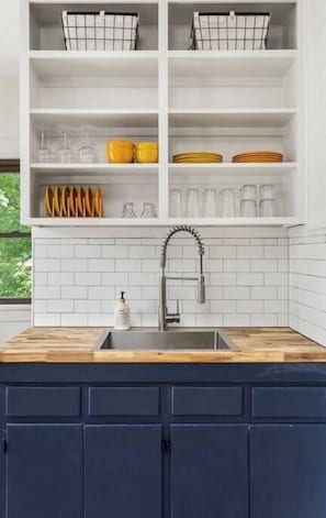 Fridge, stovetop, coffee/tea maker, cookware/dishes/utensils