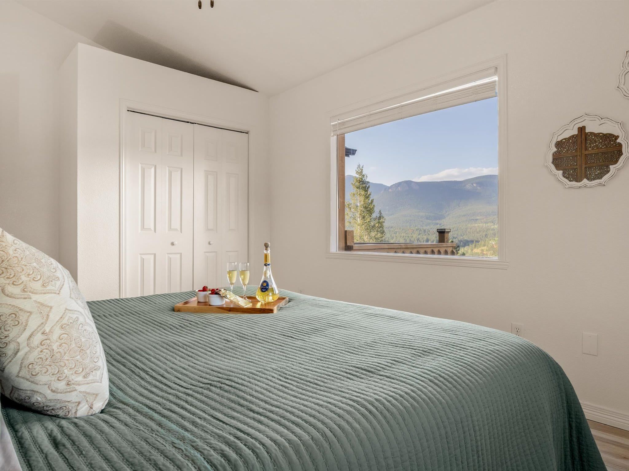 The picture window frames the dome and the Colorado summit views beyond it.