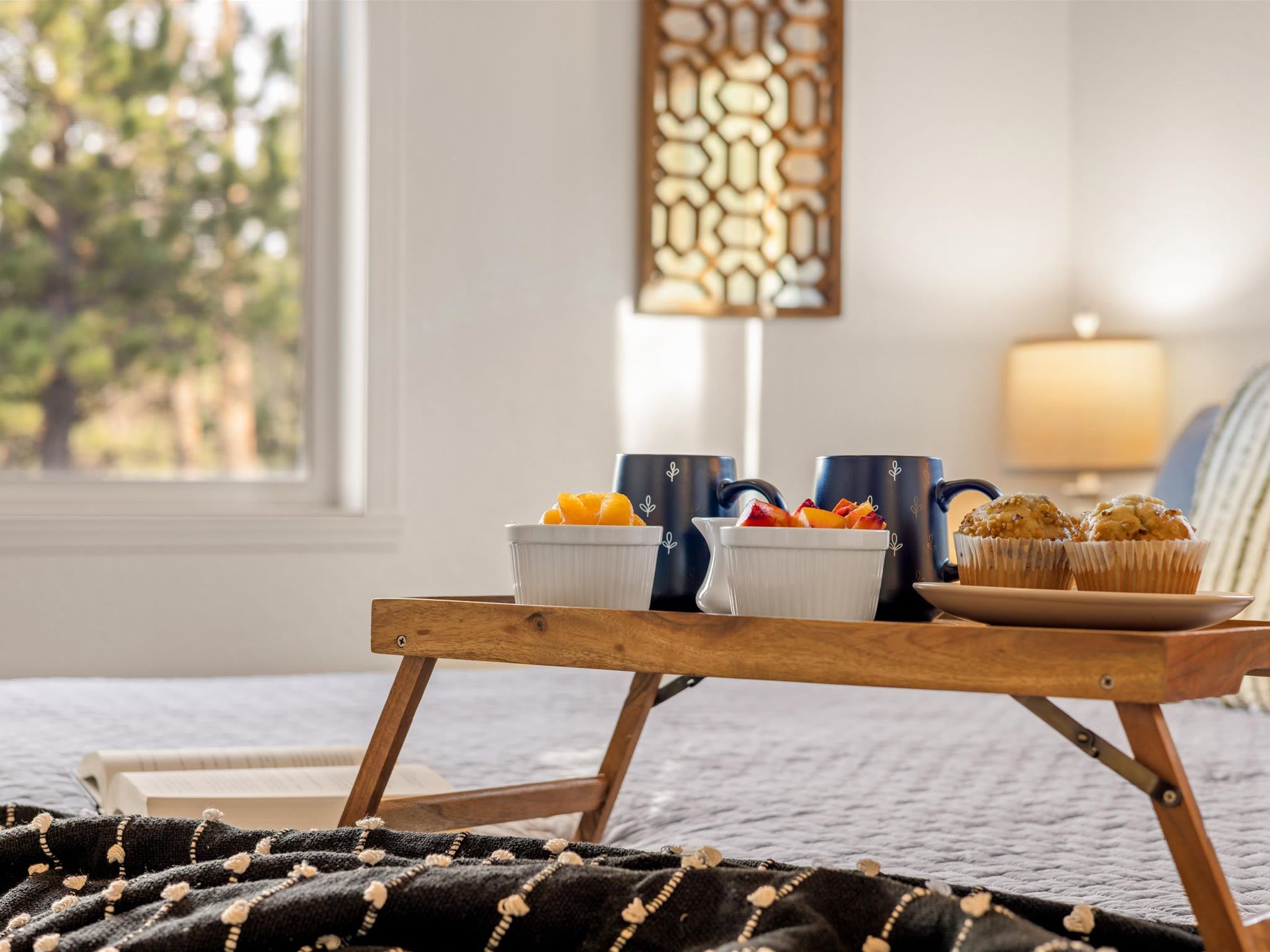 Wake up slow. Breakfast in bed with the Colorado forest just outside.