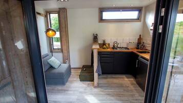 Fridge, stovetop, dishwasher, coffee/tea maker