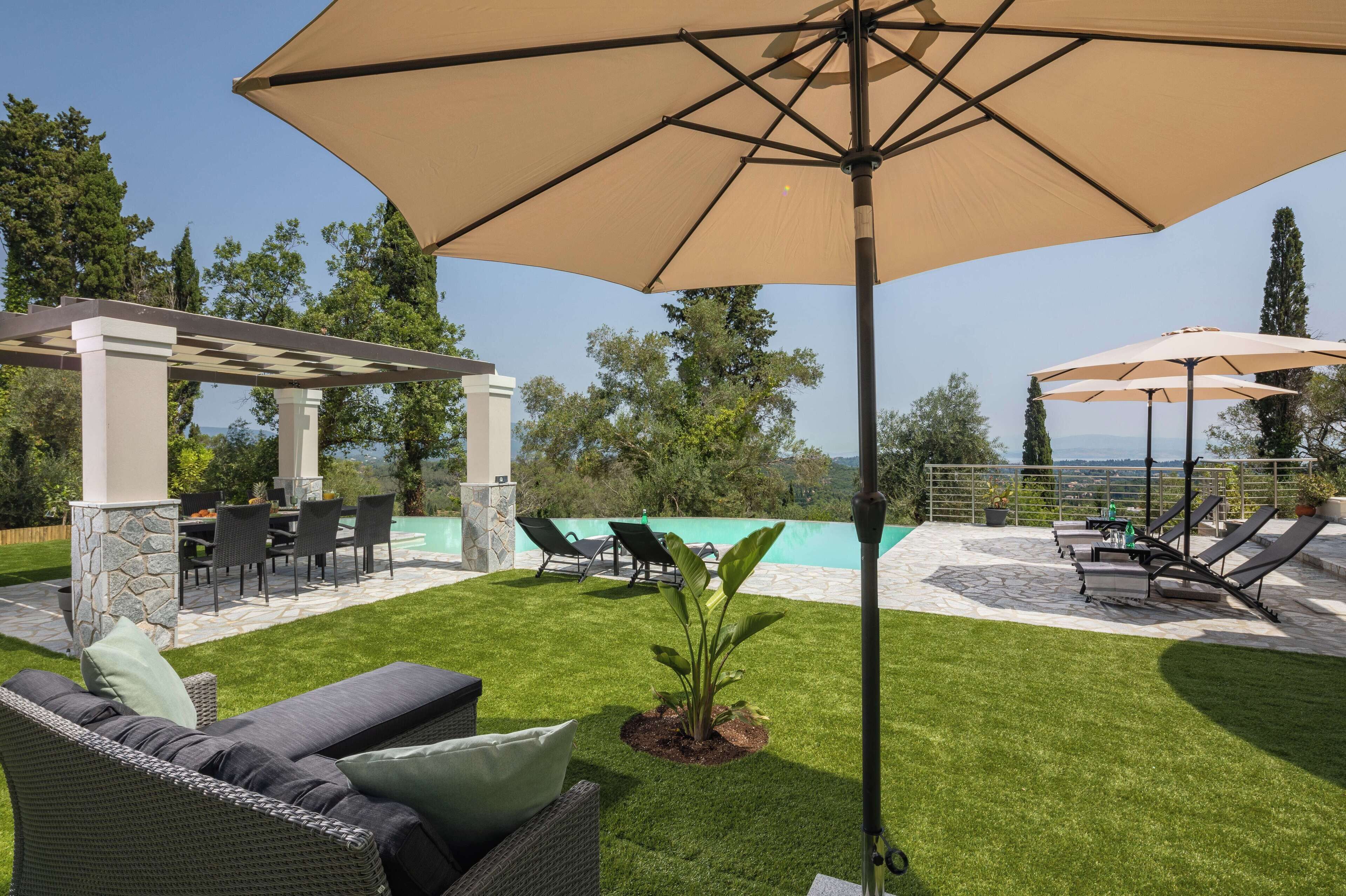 A patio with outdoor furniture, a pergola, and a view of a swimming pool.