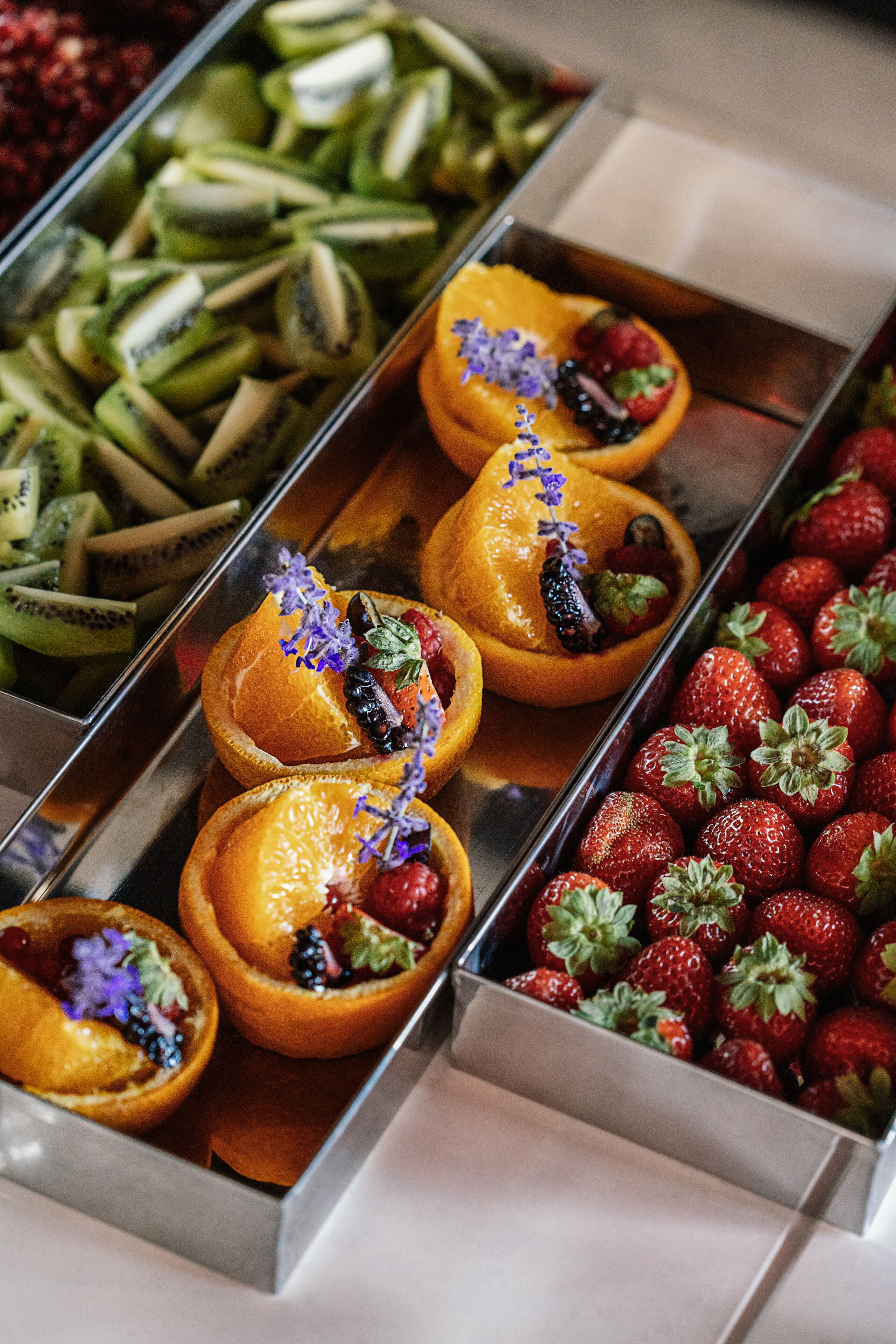 A buffet with various fruits and vegetables.