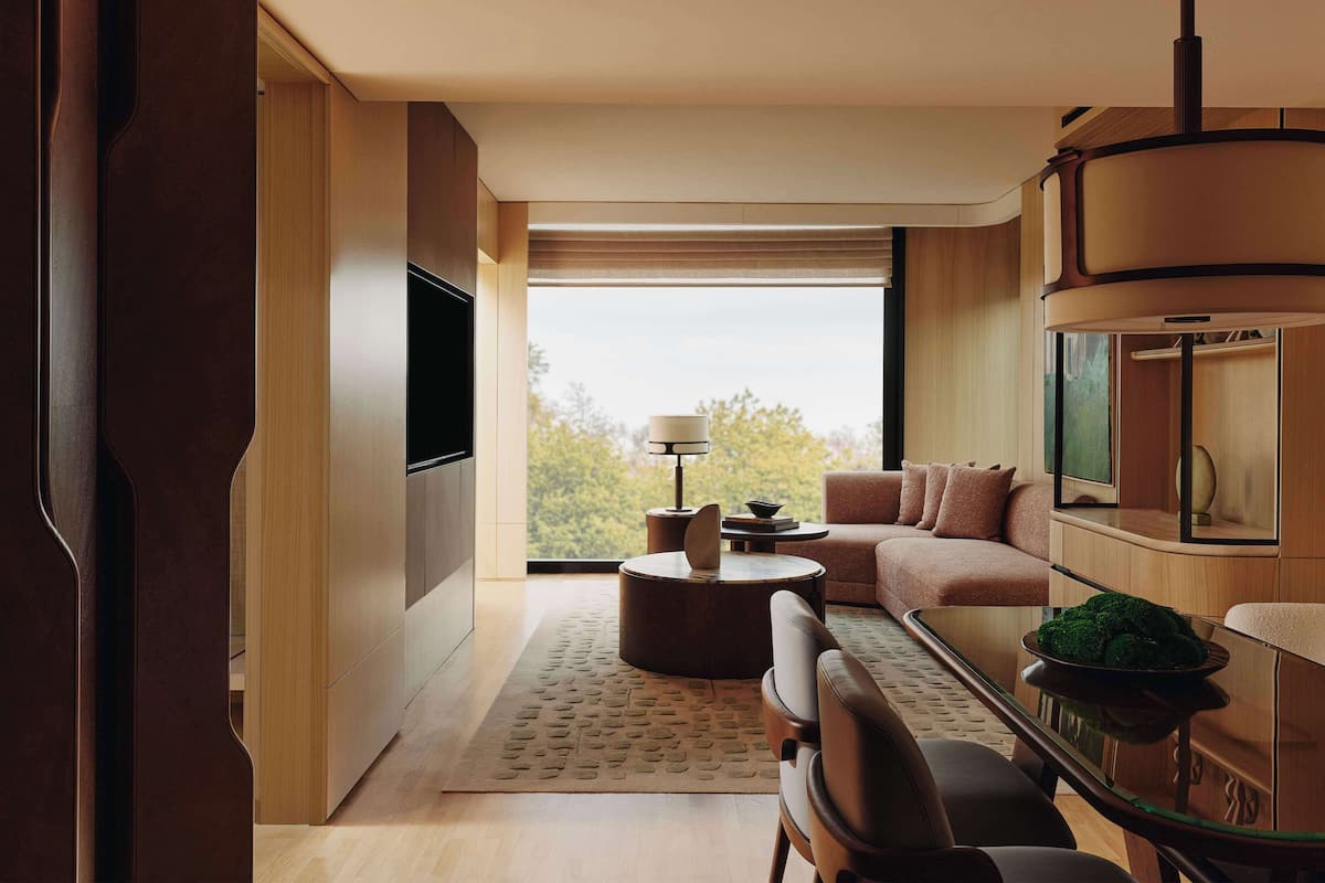 A modern living room with a sofa, coffee table, and TV.