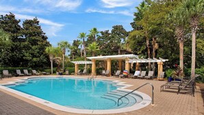 A swimming pool with lounge chairs and a pergola. - Sandestin, Baytowne Wharf, Golf Cart, Pool (Miramar Beach)