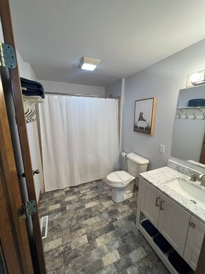 Jetted tub, hair dryer, towels, toilet paper