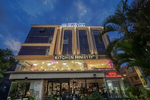 A hotel with a sign reading "Hotel The Grand Tara" and "Kitchen Ministry" below it. - HOTEL THE GRAND TARA (Indore)