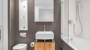 Bathtub, hair dryer, towels