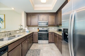 Condo, 2 Bedrooms | Private kitchen | Fridge, oven, coffee/tea maker