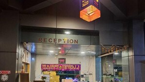 A reception area with a 'Happy Diwali' sign, a reception desk, and a 'Reception' sign above it. - Hotel Vegas (Khandala)