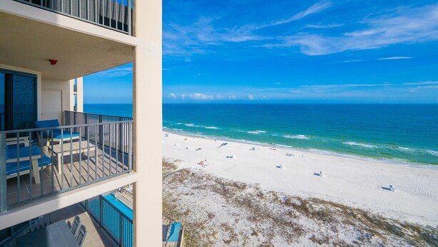 A balcony with outdoor furniture, a view of the beach, and the ocean. - Phoenix X 1202 1 Bedroom Condo (Orange Beach)