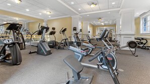 A gym with various cardio machines, mirrors, and weightlifting equipment. - 🌴 Stylish Studio Retreat in Sandestin Resort (Miramar Beach)