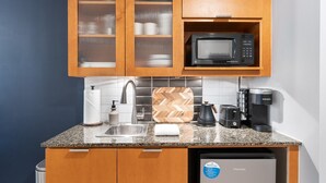 A compact kitchen with a sink, microwave, coffee maker, and a Hisense refrigerator. - 🌴 Stylish Studio Retreat in Sandestin Resort (Miramar Beach)