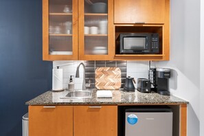 A compact kitchen with a sink, microwave, coffee maker, and a Hisense refrigerator. - 🌴 Stylish Studio Retreat in Sandestin Resort (Miramar Beach)
