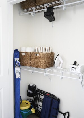 A laundry area with shelves, baskets, and a drying rack. - ✨ Stylish Beach Condo – Sleeps 6 in family friendly Gulf Place, Santa Rosa Beach (Santa Rosa Beach)