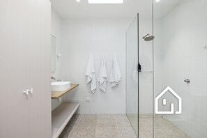 Shower, hair dryer, towels, soap