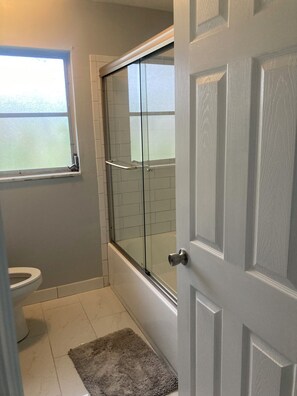 Shower, hair dryer, towels, soap