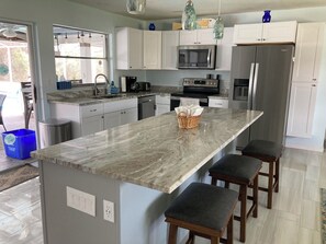 Fridge, microwave, oven, stovetop - Private updated house with heated pool! Canal frontage for boats and gulf access (Cape Coral)