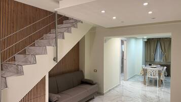 Comfort Condo | Living area | 42-inch Smart TV with digital channels