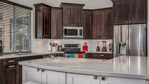 Microwave, dishwasher, coffee/tea maker, cookware/dishes/utensils