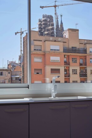 Stunning city views from a balcony with metal railings.