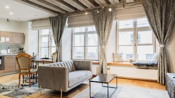 Deluxe Studio | Living area | 55-cm Smart TV with cable channels