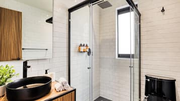 New York Style Studio | Bathroom | Shower, rainfall showerhead, towels