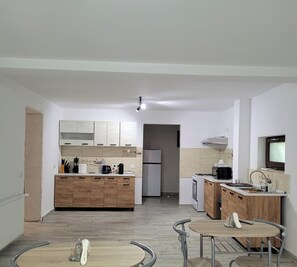 Fridge, microwave, stovetop, coffee/tea maker