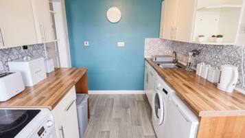 Fridge, electric kettle, toaster, cookware/dishes/utensils