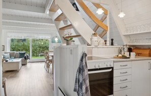 Fridge, stovetop, dishwasher, coffee/tea maker
