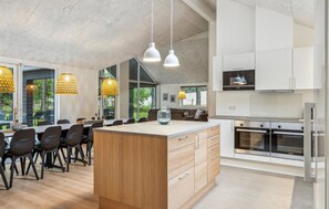 Fridge, stovetop, dishwasher, coffee/tea maker