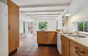 Fridge, stovetop, dishwasher, coffee/tea maker