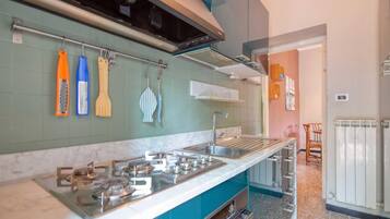 Fridge, stovetop, coffee/tea maker, cookware/dishes/utensils