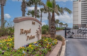 Welcome to Royal Palm Inn, where lush greenery and modern architecture blend in harmony.