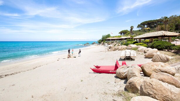 A beach with clear blue waters, a lifeguard station, and a red boat. - 3 bedroom amazing home in Parghelia -VV- (Parghelia -VV-)